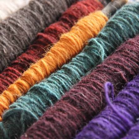 Close up of hand-dyed wool yarn used in Durree rugs